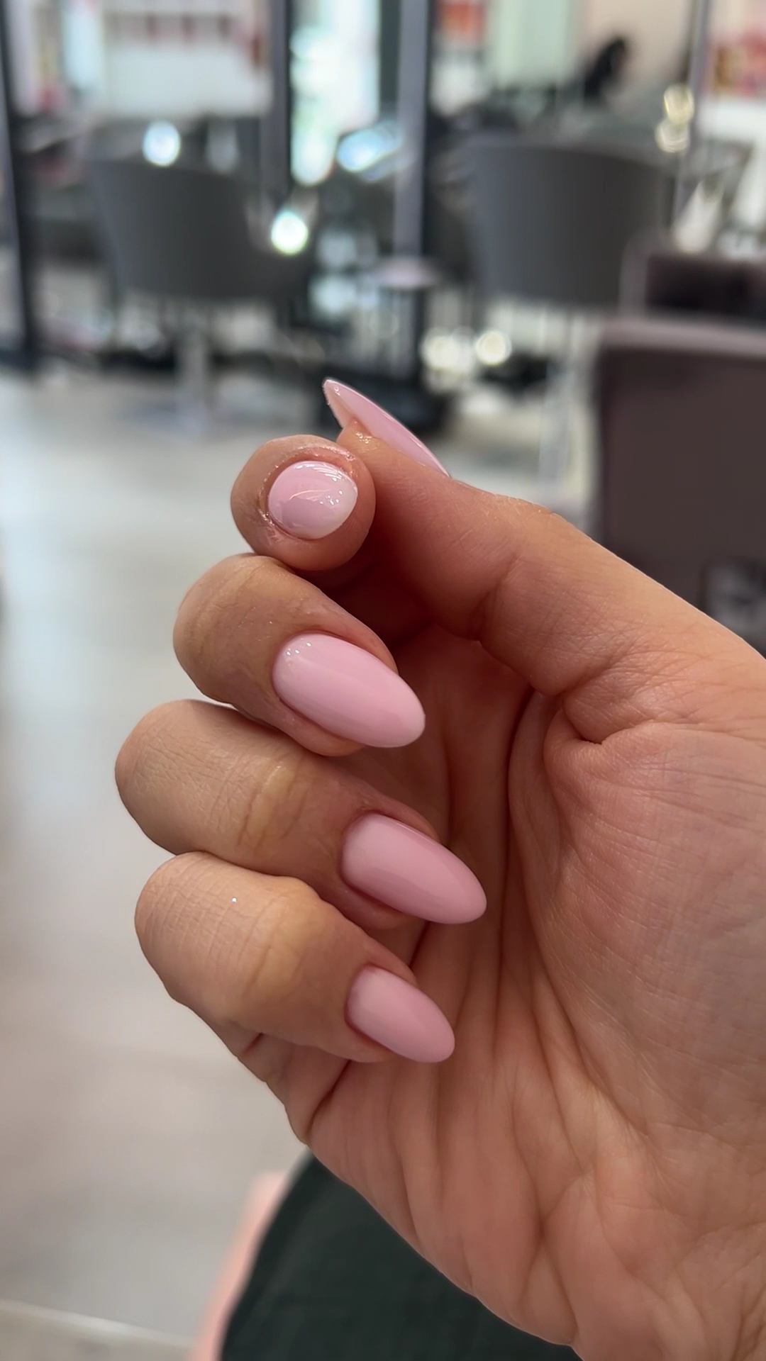 Pink almond-shaped gel manicure